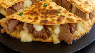Steak and cheese quesadillas cut into wedges, served hot with melted cheese
