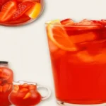 Southern strawberry sweet tea served in a clear glass with ice, fresh strawberries, and lemon for a refreshing summer drink.