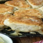 Fluffy golden 7-Up Biscuits in a cast iron skillet