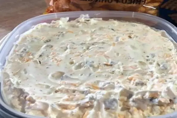 Cheddar Ranch Crack Dip in a container served with chips