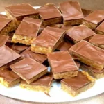 Chewy Snickers Brownies – fudgy chocolate brownies with Snickers candy bars, caramel, and peanuts
