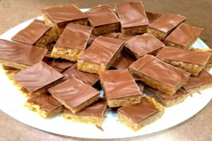 Chewy Snickers Brownies – fudgy chocolate brownies with Snickers candy bars, caramel, and peanuts