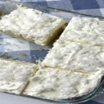 Coconut Cloud Cake recipe with fluffy whipped topping and shredded coconut