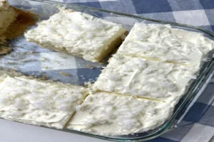 Coconut Cloud Cake recipe with fluffy whipped topping and shredded coconut