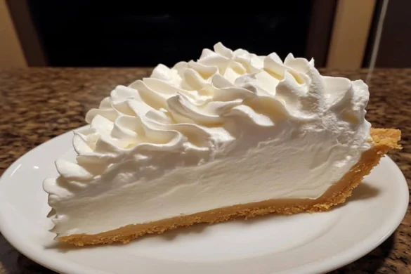 no-bake cream pie with whipped topping served on white plate