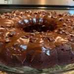 Death by Chocolate Cake topped with ganache and Nestlé chocolate chips