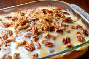 Pecan Praline Cake with a rich praline topping and chopped pecans — the perfect sweet and nutty dessert for any occasion.