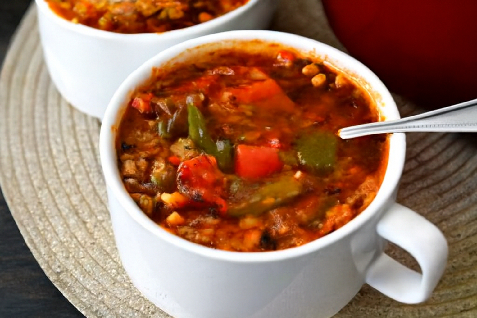 Stuffed Pepper Soup in a bowl with vibrant peppers, rice, and savory broth — perfect for cozy meals.
