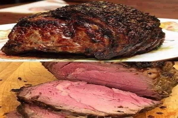 Perfect prime rib roast sliced medium-rare with herb crust