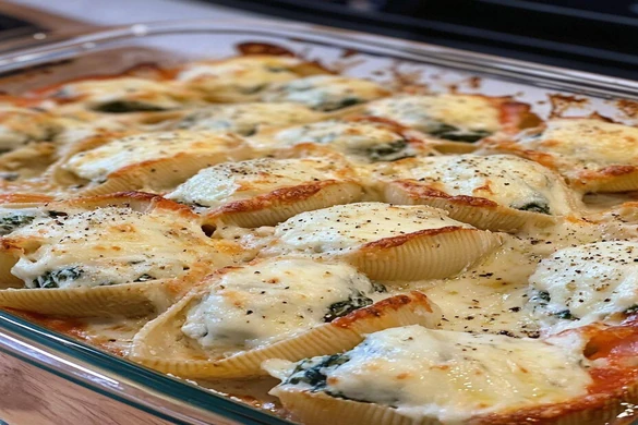Taco Stuffed Shells baked with cheese in a casserole dish