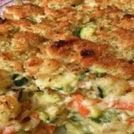 Zucchini Casserole with Stuffing Mix baked with carrots, onion, and golden buttery stuffing topping.