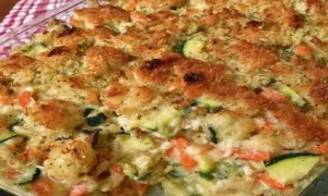Zucchini Casserole with Stuffing Mix baked with carrots, onion, and golden buttery stuffing topping.