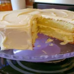 Buttermilk cake with buttercream frosting sliced and served