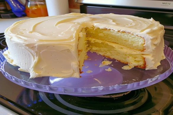 Buttermilk cake with buttercream frosting sliced and served