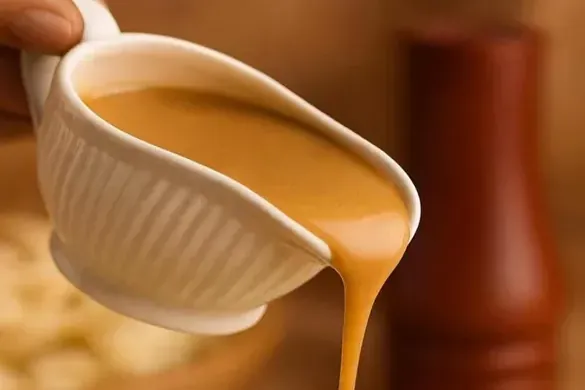 KFC gravy recipe poured over mashed potatoes
