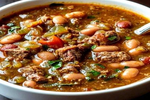 easy pinto beans green chile and beef soup in white bowl