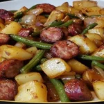 one pan sausage green beans and potatoes roasted on a tray