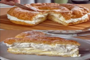 Cream Cheese Cake with creamy layers sliced on a wooden board
