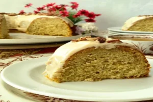 Easy Banana Vanilla Bean Caramel Cake topped with caramel glaze
