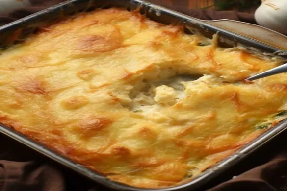 Magic Chicken Pie baked in a casserole dish with golden cheese topping.